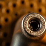 High-resolution image of a 32WIN cartridge highlighting its design for firearm enthusiasts and collectors.